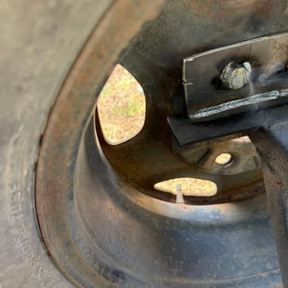 Close-up of a metal object showing welding detail and structural features for engineering analysis.